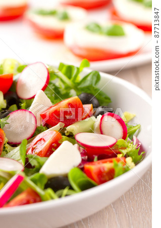 Summer Salad with Mixed Colorful Vegetables on a Plate 87713847