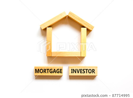 Mortgage investor symbol. Concept words 'Mortgage investor' on wooden blocks near miniature wooden house. Beautiful white background. Business, mortgage investor concept. Mortgage investor symbol. Concept words 'Mortgage investor' on wooden blocks near miniature wooden house. Beautiful white background. Business, mortgage investor concept. 87714995
