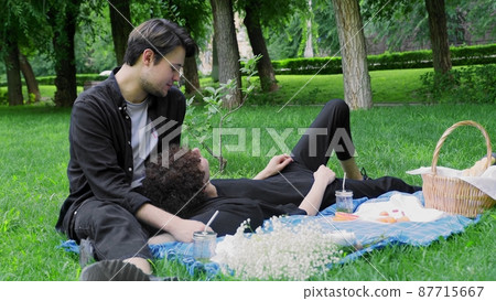 Two guys had a picnic in nature in the summer and relaxed. LGBT Two guys had a picnic in nature in the summer and relaxed. LGBT 87715667