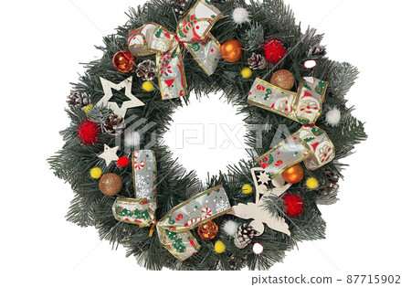 Christmas wreath decorating the front door for the holidays made of spruce, silver bows, stars and Christmas balls isolated on white background Christmas wreath decorating the front door for the holidays made of spruce, silver bows, stars and Christmas balls isolated on white background 87715902