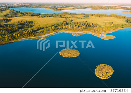 Braslaw Or Braslau, Vitebsk Voblast, Belarus. Aerial View Of Nedrava Lake And Green Forest Landscape In Sunny Autumn Morning. Top View Of Beautiful European Nature From High Attitude. Bird's Eye View 87716284