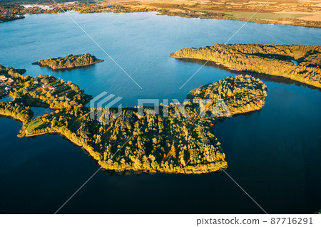 Braslaw Or Braslau, Vitebsk Voblast, Belarus. Aerial View Of Nedrava Lake, Green Forest And Meadow Landscape In Sunny Autumn Morning. Top View Of Beautiful European Nature From High Attitude. Bird's Braslaw Or Braslau, Vitebsk Voblast, Belarus. Aerial View Of Nedrava Lake, Green Forest And Meadow Landscape In Sunny Autumn Morning. Top View Of Beautiful European Nature From High Attitude. Bird's 87716291