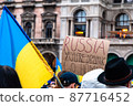 Protest against war in Ukraine in 2022 with banners and flags, Milan 87716452