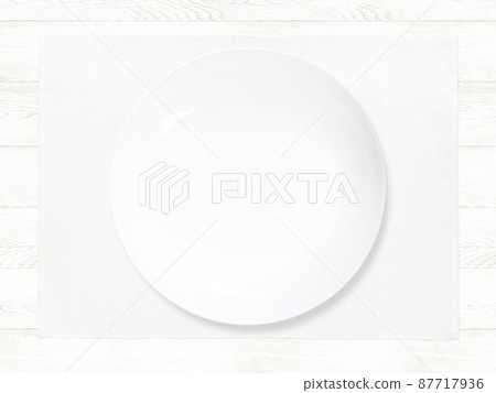 White plate placed on the table White plate placed on the table 87717936
