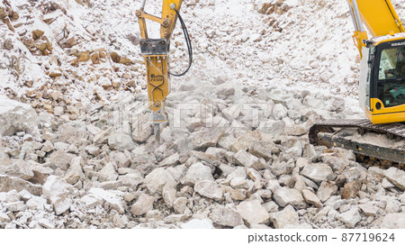 the excavator splits the stones. career equipment. 87719624