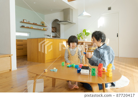 Grandma and grandson wooden house Grandma and grandson wooden house 87720417