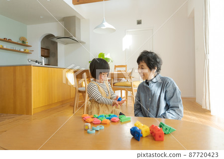 Grandma and grandson wooden house 87720423