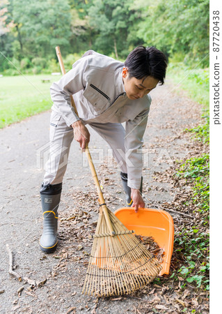 Staff cleaning the park Staff cleaning the park 87720438