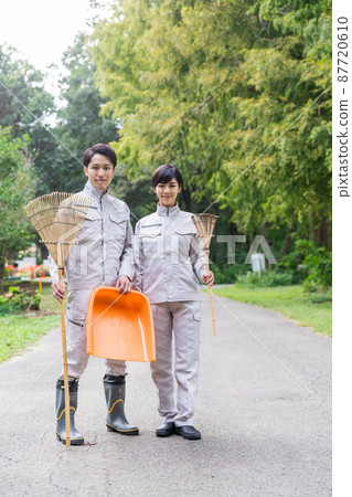 Staff cleaning the park Staff cleaning the park 87720610