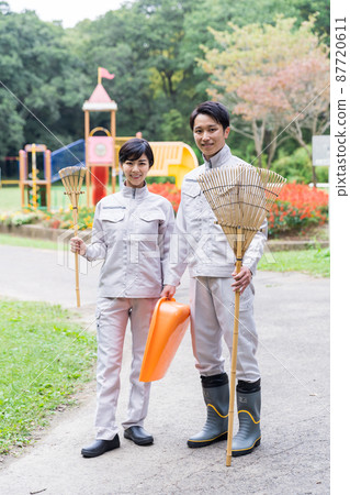 Staff cleaning the park Staff cleaning the park 87720611