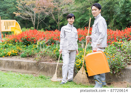 Staff cleaning the park Staff cleaning the park 87720614