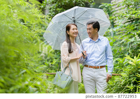 Senior couple outdoor date rainy season 87722953
