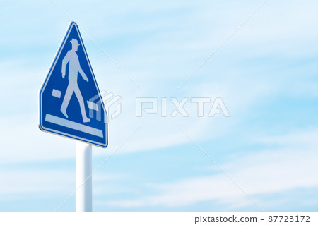 There is a road sign "pedestrian crossing" There is a road sign "pedestrian crossing" 87723172