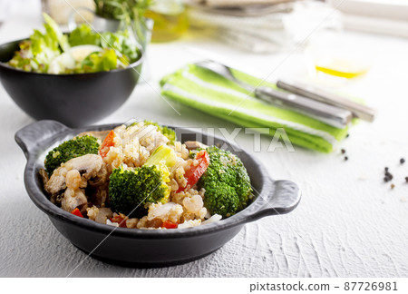 vegetarian stir fry in black pan, vegan food 87726981