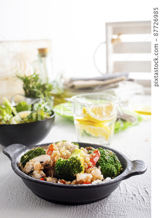 vegetarian stir fry in black pan, vegan food 87726985