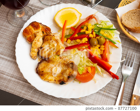 Roasted sturgeon steaks with lemon and vegetable salad Roasted sturgeon steaks with lemon and vegetable salad 87727100