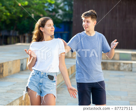 Young man is initiating a conversation with girl 87727511