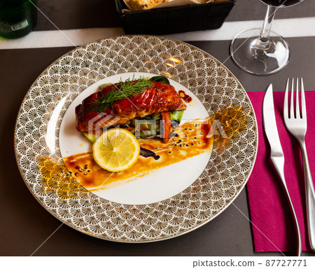 Salmon in soy-honey sauce with fried vegetables Salmon in soy-honey sauce with fried vegetables 87727771