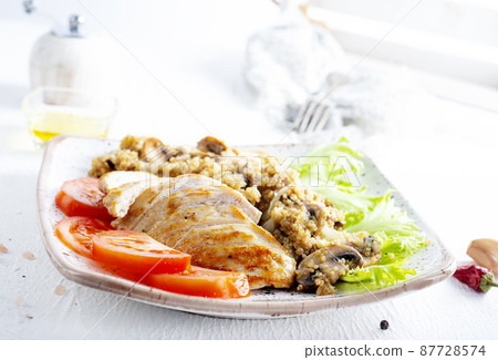 Chicken breast with fried mushrooms on plate Chicken breast with fried mushrooms on plate 87728574