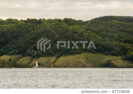 small yacht on Dniester river, Podilski tovtry, Ukraine 87728686