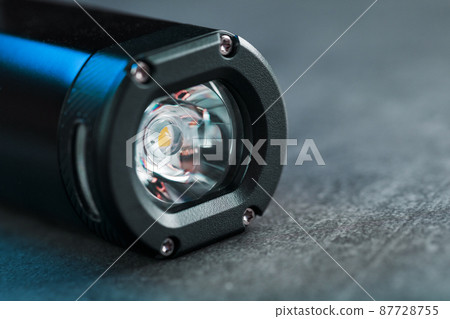 Black Rechargeable Flashlight LED handheld on a black background 87728755