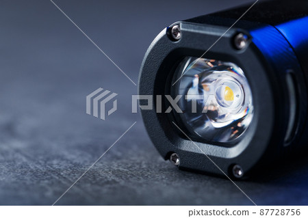 Black Rechargeable Flashlight LED handheld on a black background Black Rechargeable Flashlight LED handheld on a black background 87728756