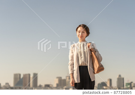 Business woman sunset evening 87728805