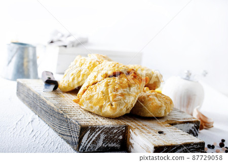 Patties fried with cabbage and meat in the dish 87729058