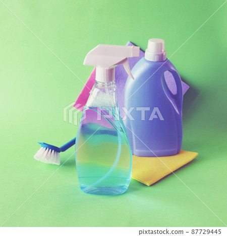 Liquid detergents in plastic bottles, household cleaning products on the table, green background, the concept of cleaning, order, cleanliness, home delivery Liquid detergents in plastic bottles, household cleaning products on the table, green background, the concept of cleaning, order, cleanliness, home delivery 87729445