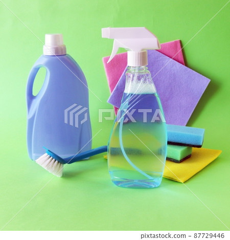 Liquid detergents in plastic bottles, household cleaning products on the table, green background, the concept of cleaning, order, cleanliness, home delivery Liquid detergents in plastic bottles, household cleaning products on the table, green background, the concept of cleaning, order, cleanliness, home delivery 87729446