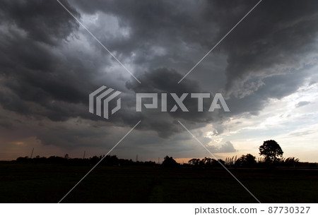 Storm clouds with the rain. Nature Environment Dark huge cloud sky black stormy cloud Storm clouds with the rain. Nature Environment Dark huge cloud sky black stormy cloud 87730327