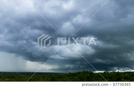 Storm clouds with the rain. Nature Environment Dark huge cloud sky black stormy cloud Storm clouds with the rain. Nature Environment Dark huge cloud sky black stormy cloud 87730365