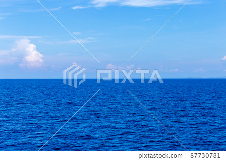 Blue Seawater with sea foam as background Blue Seawater with sea foam as background 87730781