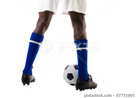 Low section of african american young male athlete with soccer ball over white background 87731005