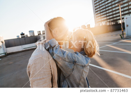 happy young couple on roof top city parking happy young couple on roof top city parking 87731463