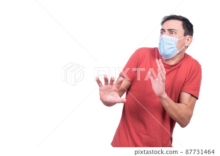 Scared man in protective mask during coronavirus pandemic Scared man in protective mask during coronavirus pandemic 87731464