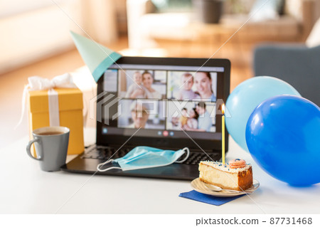 birthday cake and laptop with video call on screen birthday cake and laptop with video call on screen 87731468