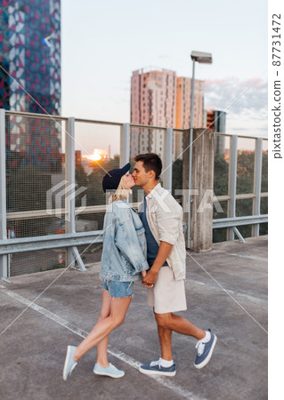 happy couple kissing on roof top city parking happy couple kissing on roof top city parking 87731472