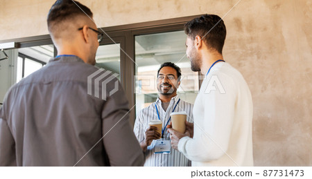 businessmen drinking takeaway coffee at office businessmen drinking takeaway coffee at office 87731473