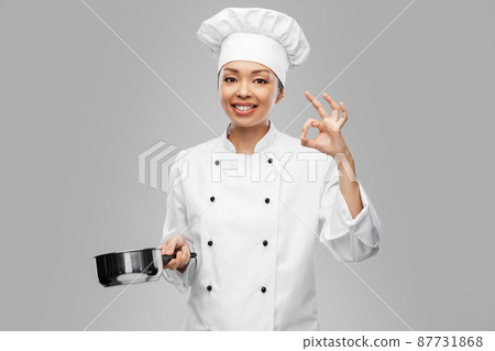 happy female chef with saucepan showing ok gesture 87731868