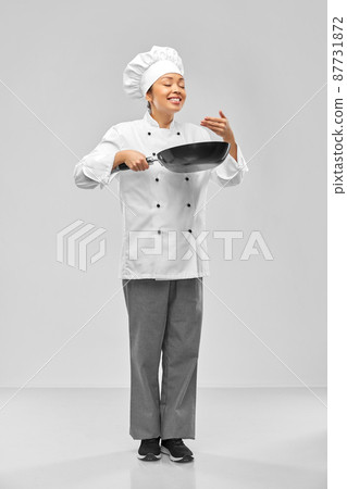 smiling female chef with frying pan smiling female chef with frying pan 87731872