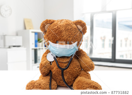 teddy bear toy in protective medical mask 87731882