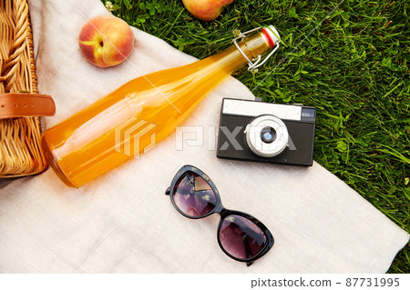picnic basket, juice bottle, sunglasses and camera picnic basket, juice bottle, sunglasses and camera 87731995