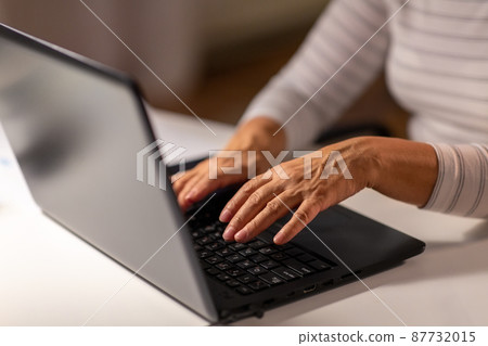hands of senior woman typing on laptop at home hands of senior woman typing on laptop at home 87732015