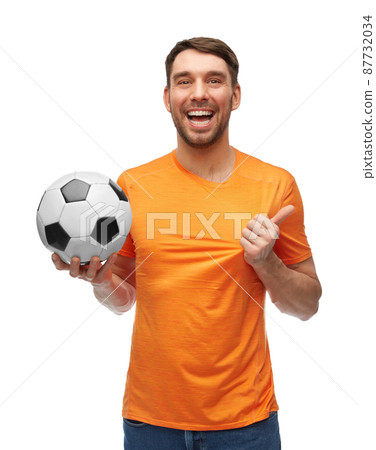 happy smiling man or football fan with soccer ball happy smiling man or football fan with soccer ball 87732034