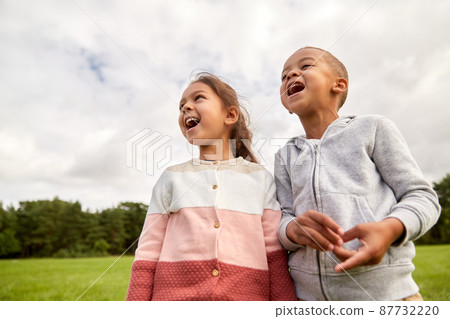 happy little boy and girl at park happy little boy and girl at park 87732220
