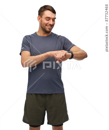 smiling man with smart watch or fitness tracker smiling man with smart watch or fitness tracker 87732468
