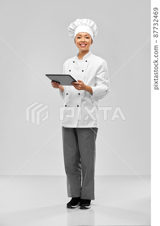 smiling female chef with tablet computer smiling female chef with tablet computer 87732469