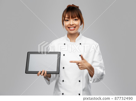 smiling female chef with tablet computer smiling female chef with tablet computer 87732490