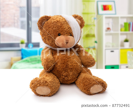 teddy bear toy with bandaged head having toothache teddy bear toy with bandaged head having toothache 87732491